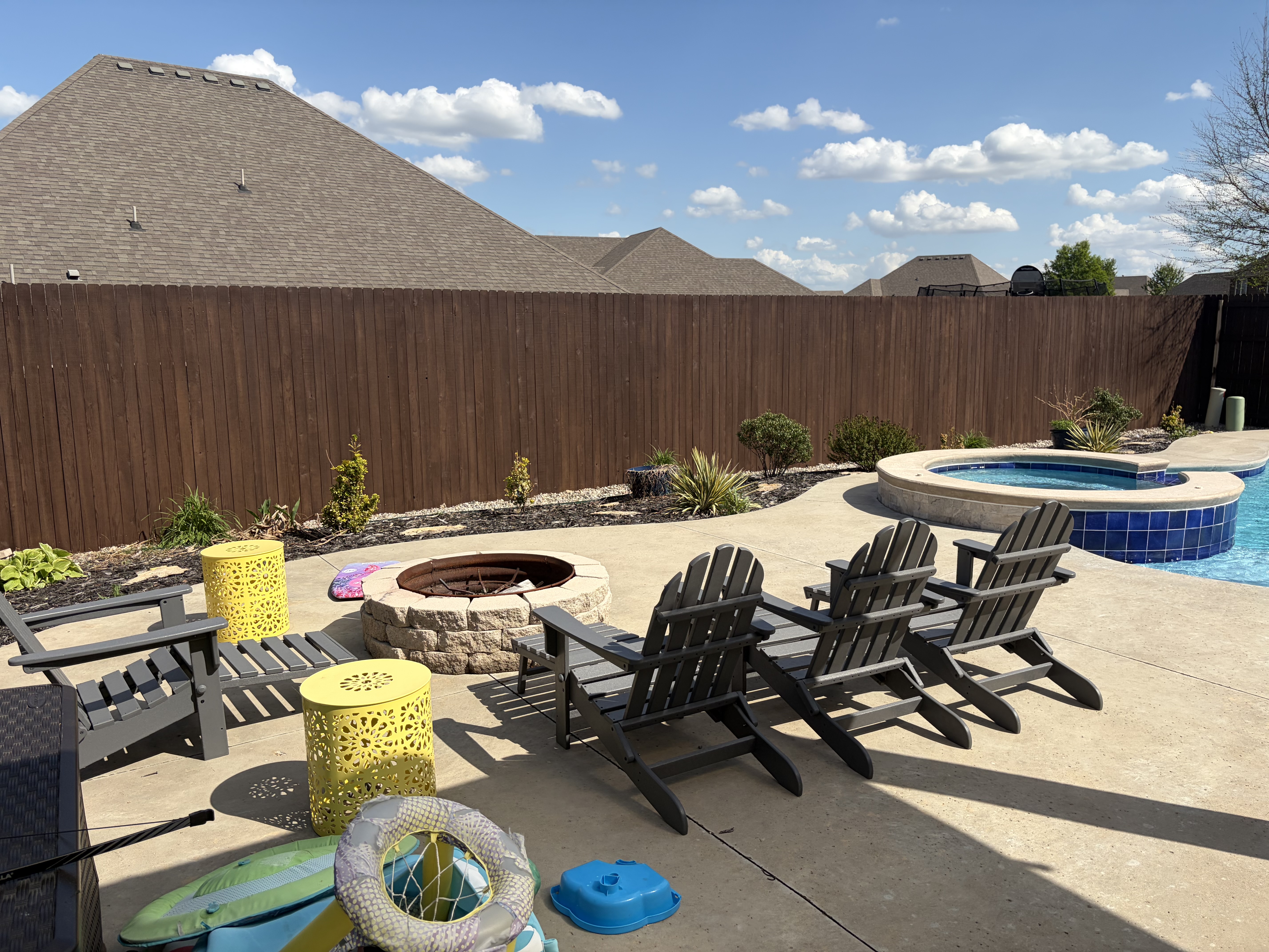 Stained wood privacy fence — pool and patio